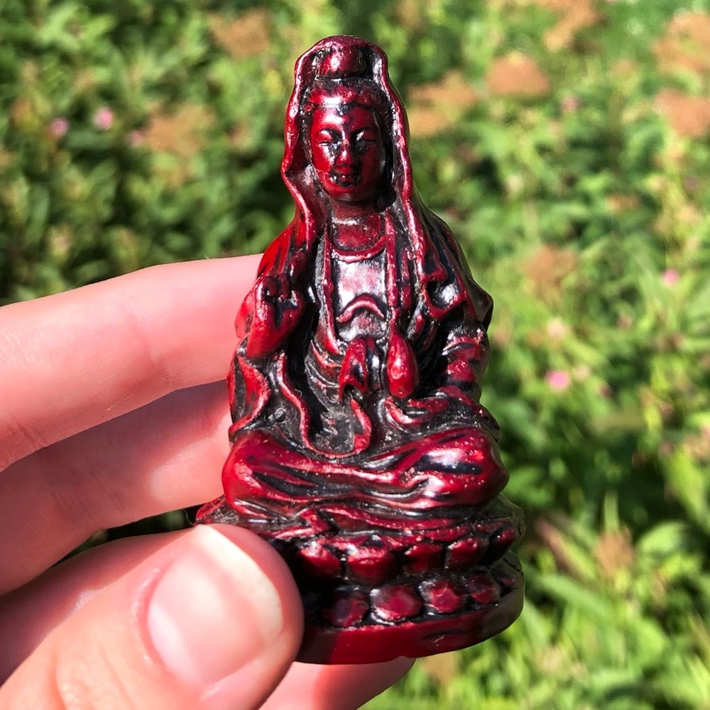 Red carved wooden figurine